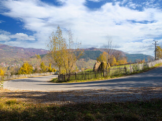 Typical autumn colours on a road at Doftana River Valley, Prahova County, Romania