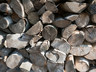 Stacked chopped fire wood. Textured background