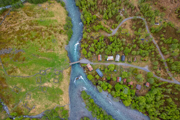 Fototapeta premium Old cabins by the flowing river