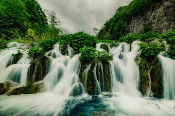 Serene waterfall in lush forest