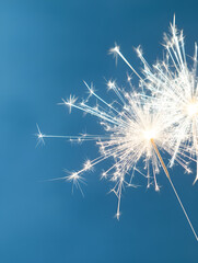 Sparkling silver fireworks on midnight blue backdrop.