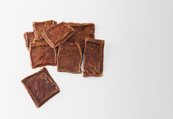 Natural dried treats for dogs. Treats for encouraging and training dogs. Animal care. Advertising treats for dogs, dried cow udder. Copy Space