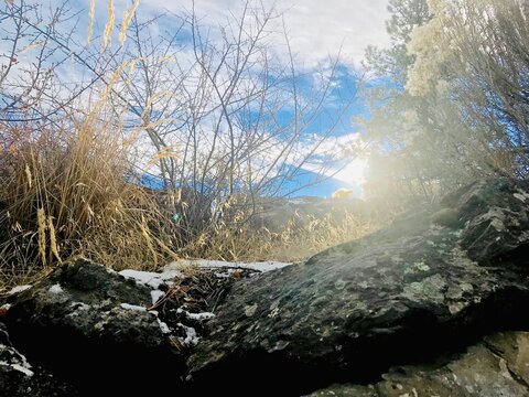 Sun peeking through the clouds inn the high desert on a winter day.