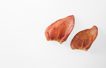 Natural chewable treats for pets. Dried Pig Ears for Dogs with copy space