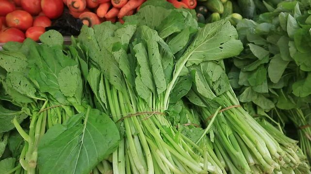 Beautifully arranged fresh vegetables at a javanese traditional market, for sale.