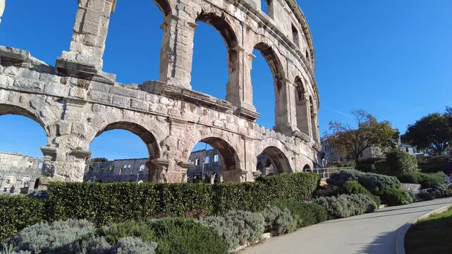 Pula, Croatia - November 3, 2024: View of the Amphitheater (Ancient Arena, Colosseum) monument of ancient Roman history and architecture. Ancient Roman stone walls.