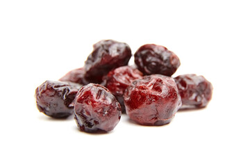 Macro shot of dried cranberries, showcasing their rich red color and wrinkled texture. Ideal for baking, cooking, or healthy snack imagery