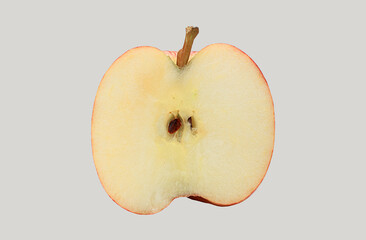 Red royal gala apple, halved, close-up view on a white background