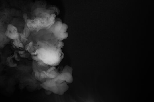 Abstract Smoke Swirls on Black Background