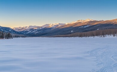 A majestic sunrise lights up the winter mountain landscape