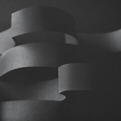 Wavy shapes made paper, dark background