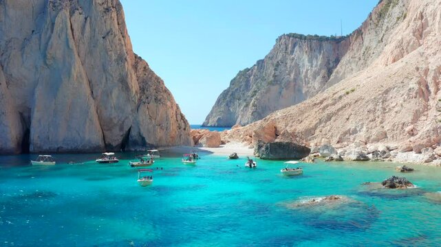 Picture perfect bay in Greece boats anchoring. Aerial view video of famous beach in Zakynthos island, Ionian Greece