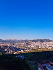 Urban Tapestry From this elevated perspective, the cityscape unfolds like a mosaic, revealing the harmonious blend of architectural styles, parks, and waterways. Sunlight dances on houses roofs