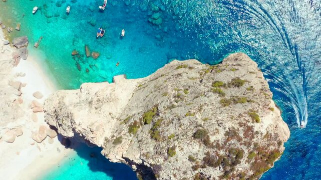 Overhead top down Greek island Zakynthos cliffs in beautiful Ionian sea in Greece. Akra Keri rock in the blue sea in Zante. Aerial drone footage looking down sea coast with turquoise sea water