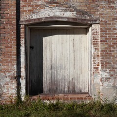 Old Loading Dock Wooden Doorway.  Abandoned Warehouse Architecture.  Grunge Textures.  Copy Space.