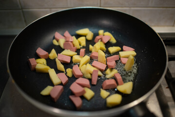 frying pan with meat and vegetables