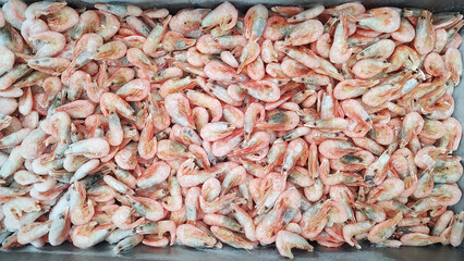 Pile of frozen shrimps close up in a freezer