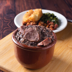 Bowl with feijoada and spices Typical Brazilian food
