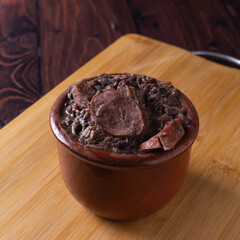 Bowl with feijoada and spices Typical Brazilian food