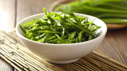 A modern presentation of Chinese asparagus salad in a white porcelain bowl, with a rustic bamboo mat underneath