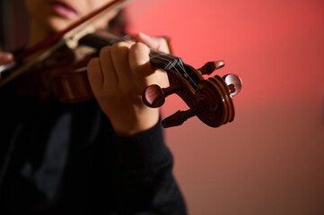 Close-up of musician playing a violin with passion and precision