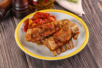 Baked lamb ribs with vegetables