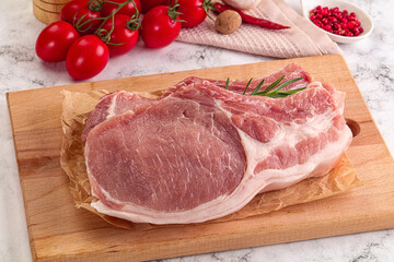 Raw potk loin steak with bone