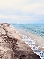 waves on the beach with black sand in the Pomorie
