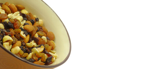 Brown bowl of nuts on white background banner