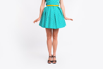 Cropped photo of attractive woman legs posing holiday dressed teal vintage style polka dot skirt...