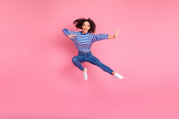 Full body portrait of nice young girl jump fight empty space isolated on pink color background
