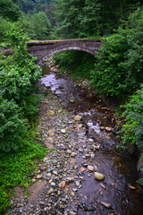 Obraz premium The Historical Yucehisar Bridge in Rize, Turkey, was built in the 19th century during the Ottoman period.