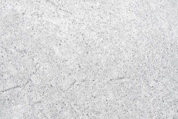 Obraz premium Empty light grey rough stone wall with black spot for abstract background and texture. beautiful patterns, space for work, banner, wallpaper close up.