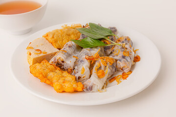 Banh Cuon Cha Muc Ha Long, vietnamese steamed rice paper rolls with minced meat inside and squid cake , Vietnamese food isolated on white background, close-up view
