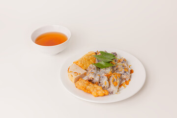 Banh Cuon Cha Muc Ha Long, vietnamese steamed rice paper rolls with minced meat inside and squid cake , Vietnamese food isolated on white background, perspective view