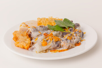 Banh Cuon Cha Muc Ha Long, vietnamese steamed rice paper rolls with minced meat inside and squid cake , Vietnamese food isolated on white background, close-up view
