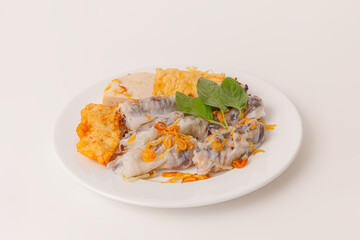 Banh Cuon Cha Muc Ha Long, vietnamese steamed rice paper rolls with minced meat inside and squid cake , Vietnamese food isolated on white background, perspective view