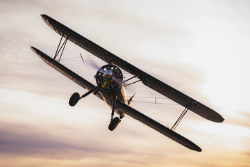 Stearman biPlane flying overhead at sunset