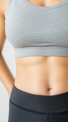 Focused Shot of Woman's Midsection in Fitness Clothing