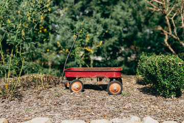 Classic Vintage Red Wagon.  Nostalgic Child Pull Toy.  Antique Garden Decoration. © Karla Earley