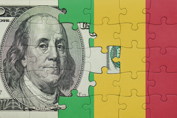 puzzle with the national flag of mali and the usa dollar money .finance concept