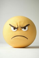 Fototapeta premium Angry yellow sphere, textured surface, simple features.