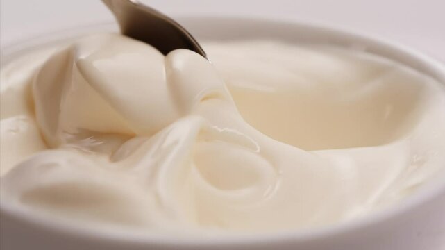 Pouring mayo white creamy sauce close-up in cafe restaurant. Cooking fast food fries with mayonaise sauce. Fast and junk food concept.