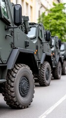 Fototapeta premium Military parade displays armored vehicles with detailed equipment set against an urban backdrop