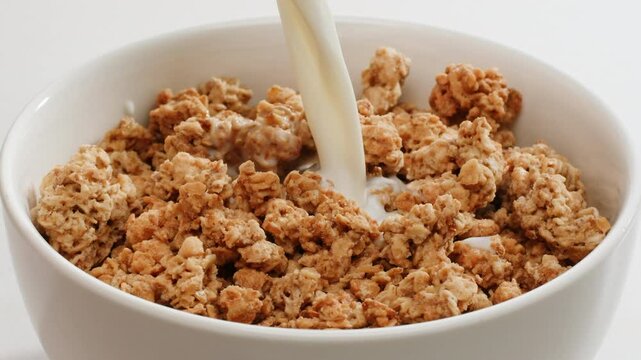 Whole grain cereals with fresh milk for breakfast, healthy breakfast with blueberry berries and yougurth kefir. Cooking morning breakfast.