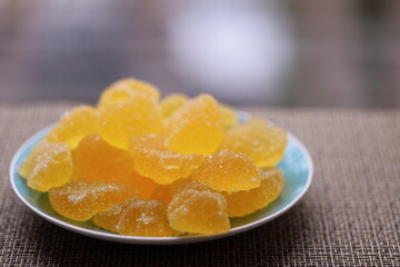 A colorful plate with various shapes and sizes of gummy bears, perfect for parties or snacks.