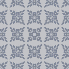 Vintage floral ornament. Simple elegant seamless pattern with abstract flower silhouettes, foliage, repeat tiles. Vector background in oriental style. Muted blue and gray color texture. Geo design