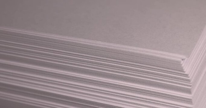 blank sheets of paper are used for printing or writing, close-up of a piece of new pulp paper