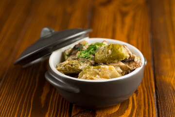 Brussel sprouts stewed in sour cream sauce with mushrooms and spices