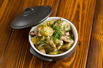 Brussel sprouts stewed in sour cream sauce with mushrooms and spices